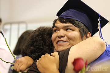 &lt;p&gt;Brandon Conko gives his mom a hug during the rose ceremony at graduation, where students gives roses in thanks to family and friends for their support.&lt;/p&gt;