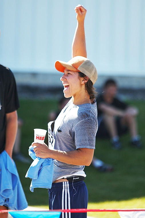 <p>Jonni Pekus of Whitefish cheers on a friend near the finish line Saturday morning during the Rocky Mountain Bank Summit Classic at The Summit.</p>