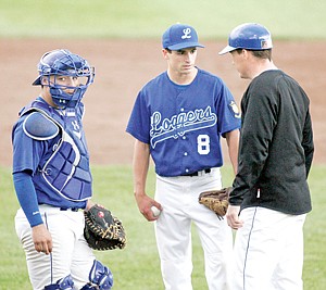 &lt;p&gt;Logger coach Kelly Morford talked to pitcher Creede Garcia in the first game, as Micah Germany looked on.&lt;/p&gt;