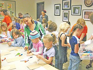 &lt;p&gt;Fourth grade girls cut out their moose heads to paste on the paper bags. In the adjoining room, first grade boys watch an outdoor safety video.&lt;/p&gt;