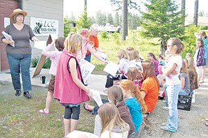 &lt;p&gt;After the paperwork, the girls get directions to find pinecones to make their craft project. Every group had a different project or activity to keep them busy and learning.&lt;/p&gt;