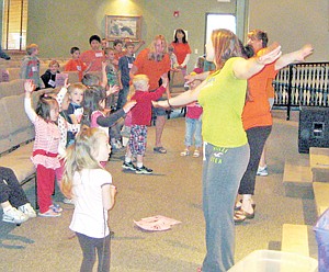 &lt;p&gt;The children and volunteers at Vacation Bible School show off their dance moves before breaking into groups.&lt;/p&gt;