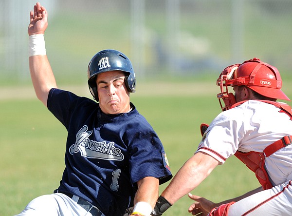 Robby King, 1, is tagged out as he attempts to slide into home in the game against the Lakers on Tuesday in Kalispell.
