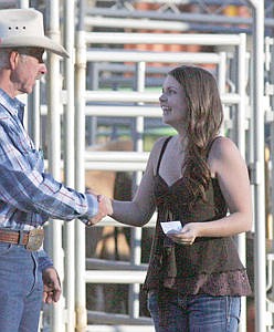 &lt;p&gt;Shannon Rowberry receives a $1,000 scholarship check from Brett Bronson Saturday evening during Incredi-Bull 2015.&lt;/p&gt;