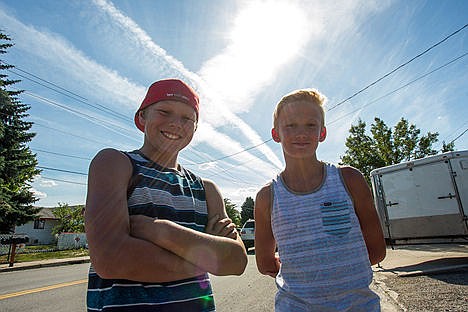 &lt;p&gt;Michael Williams, left and Zachary Enderson stand at the intersection of Third and Bay in Post Falls where they found a wallet containing credit cards, over $700 and other items. The two eleven year old boys turned the wallet into the police and it was returned to the rightful owner.&lt;/p&gt;