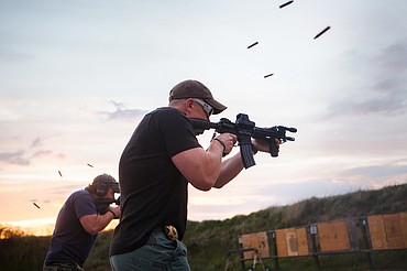 <p>Sheriff's deputies demonstrate how they would provide cover fire using automatic weapons during range day at Sheriff's Citizens' Academy.</p>