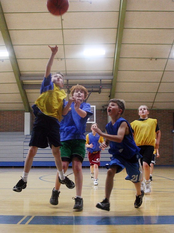 Skyler Chisholm, goes up for a layup in the basketball league games.