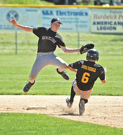 Mission Valley Rockies' second baseman Tyler Delaney tries to apply the tag on the Polson Pirates Jared Young during the Rockies' 4-3 victory over the Pirates in the Polson Babe Ruth Tournament Championship Game last Sunday.