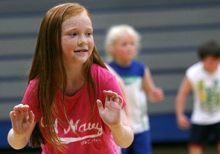 Bailey Chisholm, 8 works on her defensive stance during the Thompson Falls' basketball camp.
