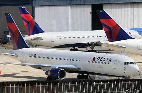 &lt;p&gt;In this April 20, 2010 photo, Delta Air Lines jets are parked at John F. Kennedy International Airport in New York. United Airlines executives on Tuesday said that they have agreed to trade the airline's JFK takeoff and landing slots to Delta Air Lines in exchange for Delta's slots at Newark Liberty International Airport.&lt;/p&gt;