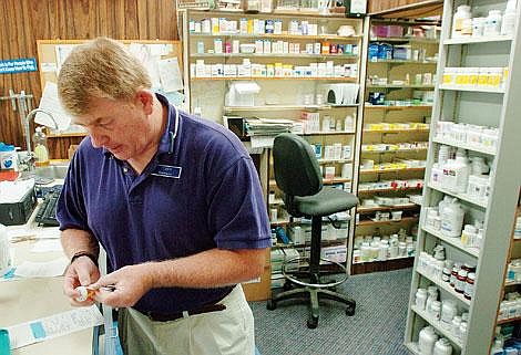 Pharmacist Tobey Schule works on prescriptions Friday at Sykes' in Kalispell. Schule recently was recognized as pharmacist of the year by the Montana Pharmacy Association. Chris Jordan/Daily Inter Lake
