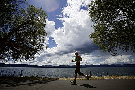 &lt;p&gt;Laura Narolski jogs along Lake Coeur d'Alene on the Centennial Trail on a cloudy Thursday afternoon in preparation for her first Ironman triathlon. Narolski was diagnosed with breast cancer March 2011 and made a comment once her treatments were completed January 2012 to race in Ironman Coeur d'Alene.&lt;/p&gt;