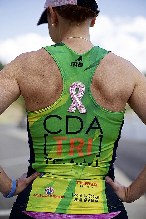 &lt;p&gt;Laura Narolski wears a pink ribbon on her triathlon jersey which she'll wear Sunday during Ironman Coeur d'Alene.&lt;/p&gt;