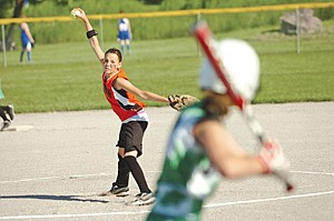 Sammy Coleman delivers a pitch for the 12U Ronan Orange and Black Attack during the Polson Splash Tournament.