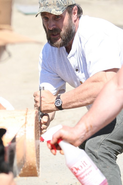 James Jermyn of Plains works the saw in the cross cutting competition during Plains Day.