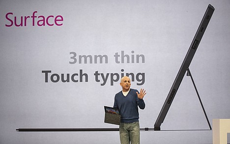 &lt;p&gt;Steven Sinofsky, the president of Microsoft's Windows division holds &quot;Surface&quot;, a new tablet computer at Hollywood's Milk Studios in Los Angeles Monday, June 18, 2012. The 9.3 millimeter thick tablet comes with a kickstand to hold it upright and keyboard that is part of the device's cover. It weighs under 1.5 pounds. (AP Photo/Damian Dovarganes)&lt;/p&gt;