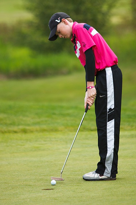 <p>Patrick Cote/Daily Inter Lake Riggs Johnston sinks a par put on Hole 2 at Meadow Lake Golf Course Tuesday afternoon during the Flathead Valley Junior Tour. Tuesday, June 12, 2012 in Columbia Falls, Montana.</p>