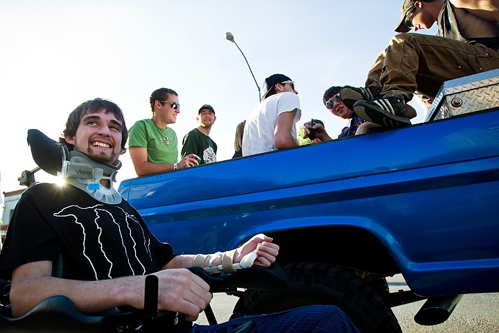 &lt;p&gt;Jimmy Johnston, 20, joins his friends curbside as riders climb into the back of his 1969 Ford F250 pickup Friday during the 20th Annual Car D'Lane Classic Car Cruise and Show on Sherman Avenue.&lt;/p&gt;