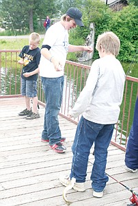 &lt;p&gt;Christian Huffman laughs as he holds up his recent spoils, a small trout dancing and shimmying by his feet. Huffman won second place for catching a more than two pound fish. Prizes consisted of fishing gear to let the hobby grow.&lt;/p&gt;