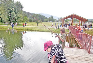 &lt;p&gt;Kids and their parents fish, relax and play around near the dock at Troy&#146;s Roosevelt Park pond, stocked with fish.&lt;/p&gt;