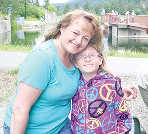 &lt;p&gt;Becky and Kaitlyn Troyer pose for the camera after Kaitlyn had snagged a .57 pound cutthroat out of the heavily stocked Roosevelt Park pond. Fish and Wildlife had stocked the pond with 120 brood stock trout, 500 cutthroat and 1,200 rainbow trout. Kids and parents weren&#146;t the only ones to hunt for fish, as an opportunistic osprey soared above, looking for the glint of a trout&#146;s scales.&lt;/p&gt;