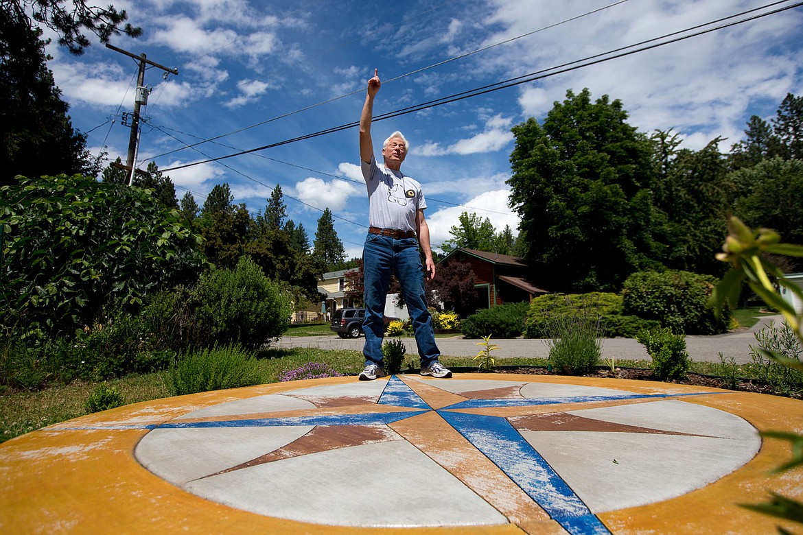 &lt;p&gt;JAKE PARRISH/Press Ray Tekverk, a retired science teacher, points to planets in the sky, something he can accurately do using the compass rose he built in his front yard two years ago. The compass rose's north point, where Tekverk is standing on in this photograph, points to a perfect true north.&lt;/p&gt;