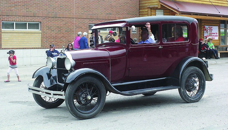 &lt;p&gt;Grand Marshal Bud Bras drives his Ford Model A down Main Street during the grand parade on Sunday in Hot Springs.&lt;/p&gt;