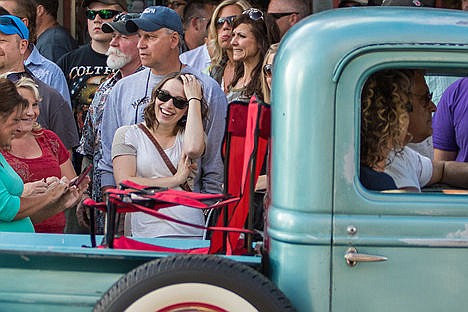 &lt;p&gt;Cassie Willson, center, laughs with friends during the Car d'Lane cruse in Coeur d'Alene on Friday evening.&lt;/p&gt;