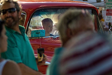 &lt;p&gt;A young boy sits in the front seat of a truck during the Car d'Lane cruise down Sherman Ave.&lt;/p&gt;