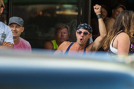 &lt;p&gt;A man cheers as a car he enjoyed drove past him on Friday evening at the Car d'Lane event.&lt;/p&gt;