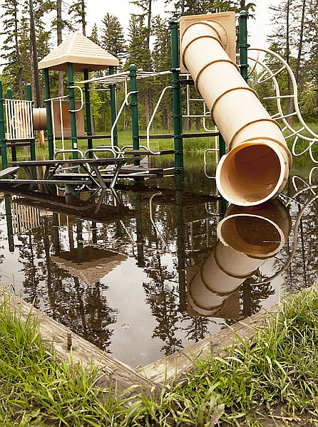 With so much land covered by standing water, such as this play structure in Lawrence Park, 2011 could be a big year for mosquitoes.
