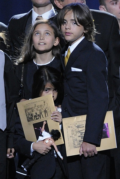 <p>In this July 7, 2009 photo, Paris Jackson, left, Prince Michael Jackson I and Prince Michael Jackson II on stage during the memorial service for Michael Jackson at the Staples Center in Los Angeles.</p>