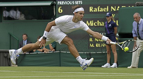 &lt;p&gt;Spain's Rafael Nadal in action during his first round match against Michael Russell of the US on Monday at Wimbledon.&lt;/p&gt;