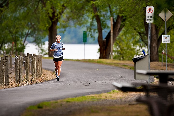 &lt;p&gt;Aly Houghton of Coeur d'Alene goes for a training run out the Centennial Trail near Bennett Bay of Lake Coeur d'Alene on Sunday in preparation for next weekend's Ironman Triathlon.&lt;/p&gt;
