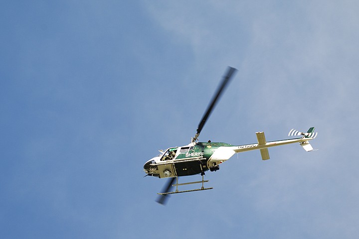 &lt;p&gt;Spokane County Sheriff's Department helicopter Air One circles the Park Place Apartments in Coeur d'Alene. (SHAWN GUST/Press)&lt;/p&gt;