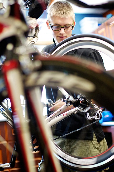 &lt;p&gt;Cody Helbling looks over a customer's bike Tuesday at Mountain View Cyclery and Fitness in Hayden.&lt;/p&gt;