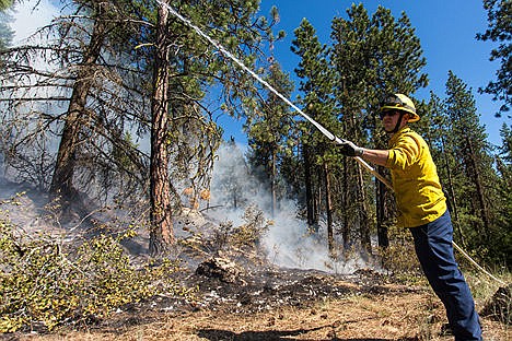 &lt;p&gt;Don Bates sprays the north west edge of the Tubbs Hill fire on Saturday evening.&lt;/p&gt;