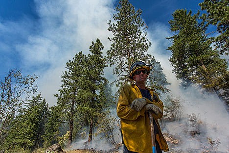 &lt;p&gt;Mike Fredrick takes a break from digging a trench around the perimeter of the Tubbs Hill fire on Saturday evening.&lt;/p&gt;