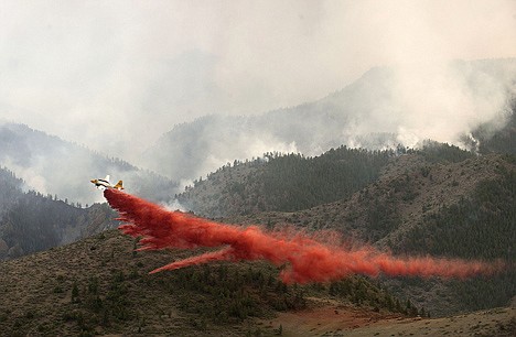 &lt;p&gt;An aircraft drops a load of fire retardant slurry above the High Park wildfire about 15 miles west of Fort Collins, Colo., on Tuesday. The ammonium phosphate dropped from airplanes to slow the spread of raging wildfires can turn a pristine mountain stream into a death zone for trout and some say the retardant has never been proven effective.&lt;/p&gt;