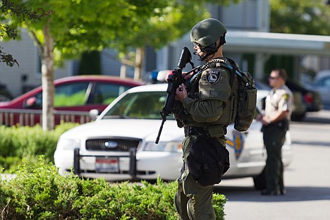 &lt;p&gt;A Coeur d'Alene Police Department SWAT team member holds a perimeter Thursday near an apartment housing a suspected gunman at Park Place Apartments in Coeur d'Alene.&lt;/p&gt;