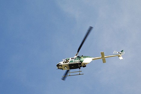 &lt;p&gt;Spokane County Sheriff's Department helicopter Air One circles the Park Place Apartments in Coeur d'Alene.&lt;/p&gt;