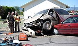 Minivan crash-lands on top of car