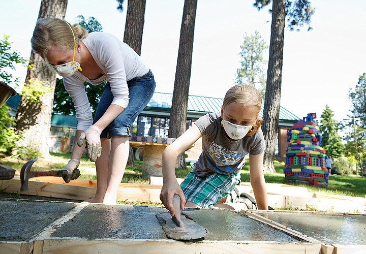 &lt;p&gt;SHAWN GUST/Press Abby Hunter, 11, right, and Hannah Pettit, 13 work on smoothing blocks of freshly poured concrete Wednesday that will be for art projects an annual workshop at the Harding Family Center hosted through the Patrick Flammia Drawing Institute.&lt;/p&gt;