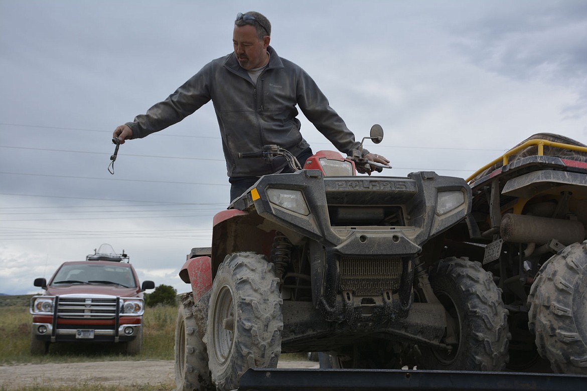 &lt;p&gt;&lt;strong&gt;POLSON AMBULANCE Medic Mike Cullen drives one of his family&#146;s ATVs onto its trailer after spending a day at the Poker Run with his wife, Christine Cullen and daughter Sarah Cullen, 17.&lt;/strong&gt;&lt;/p&gt;&lt;p&gt;&lt;strong&gt;&#160;&lt;/strong&gt;&lt;/p&gt;