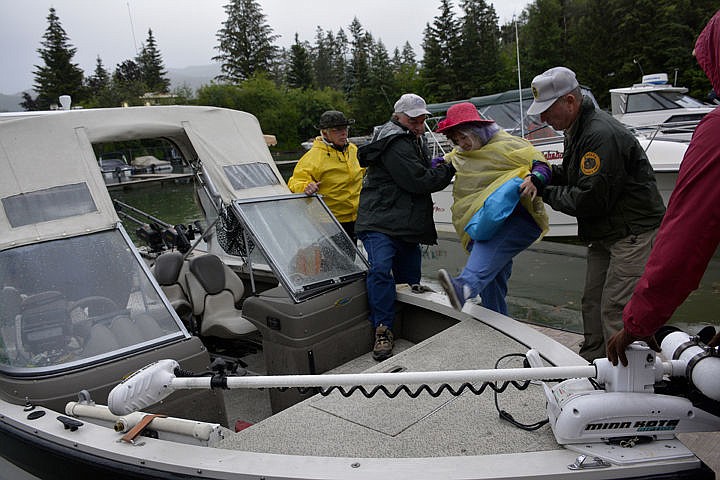 &lt;p&gt;Wanda Hobbs (Pink hat) steps over the side of a boat to get started on her fishing day.&lt;/p&gt;