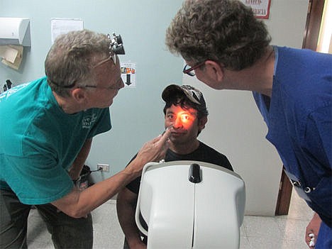 &lt;p&gt;Dr. Justin StormoGipson and Dr. Rupert Chowins examine a patient&#146;s eyes.&lt;/p&gt;