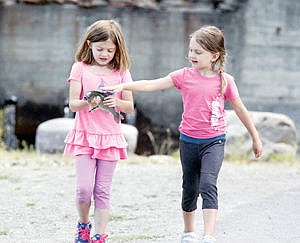 &lt;p&gt;Riley McNew, 7, left, Jamisen Williams 6, right. Heading to the scales to weigh in with Riley carrying Jamisen's fish for her. Contestants were allowed to keep two.&lt;/p&gt;