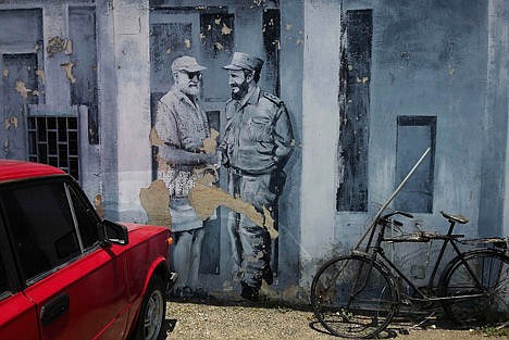 &lt;p&gt;A mural of author Ernest Hemingway and Fidel Castro shaking hands covers a downtown parking lot in Havana, Cuba, Monday. Cuban architects, engineers and workmen will construct a two-story laboratory where thousands of photos, books and letters to and from Hemingway can be treated and preserved.&lt;/p&gt;