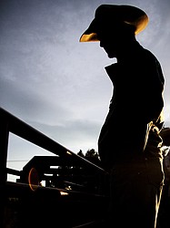 <p>A cowboy looks out into the arena during the Blue Moon Summer Series rodeo in Columbia Falls on Thursday, June 14.</p>
