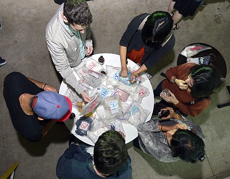 &lt;p&gt;Partygoers reach for bagged shirts during a pheromone party on Friday in Los Angeles. The get-togethers, which have been held in New York and Los Angeles and are planned for other cities, require guests to submit a slept-in T-shirt that will be sniffed by other participants. Then you can pick your partner based on scent.&lt;/p&gt;